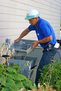 technician-repairing-outdoor-AC-unit