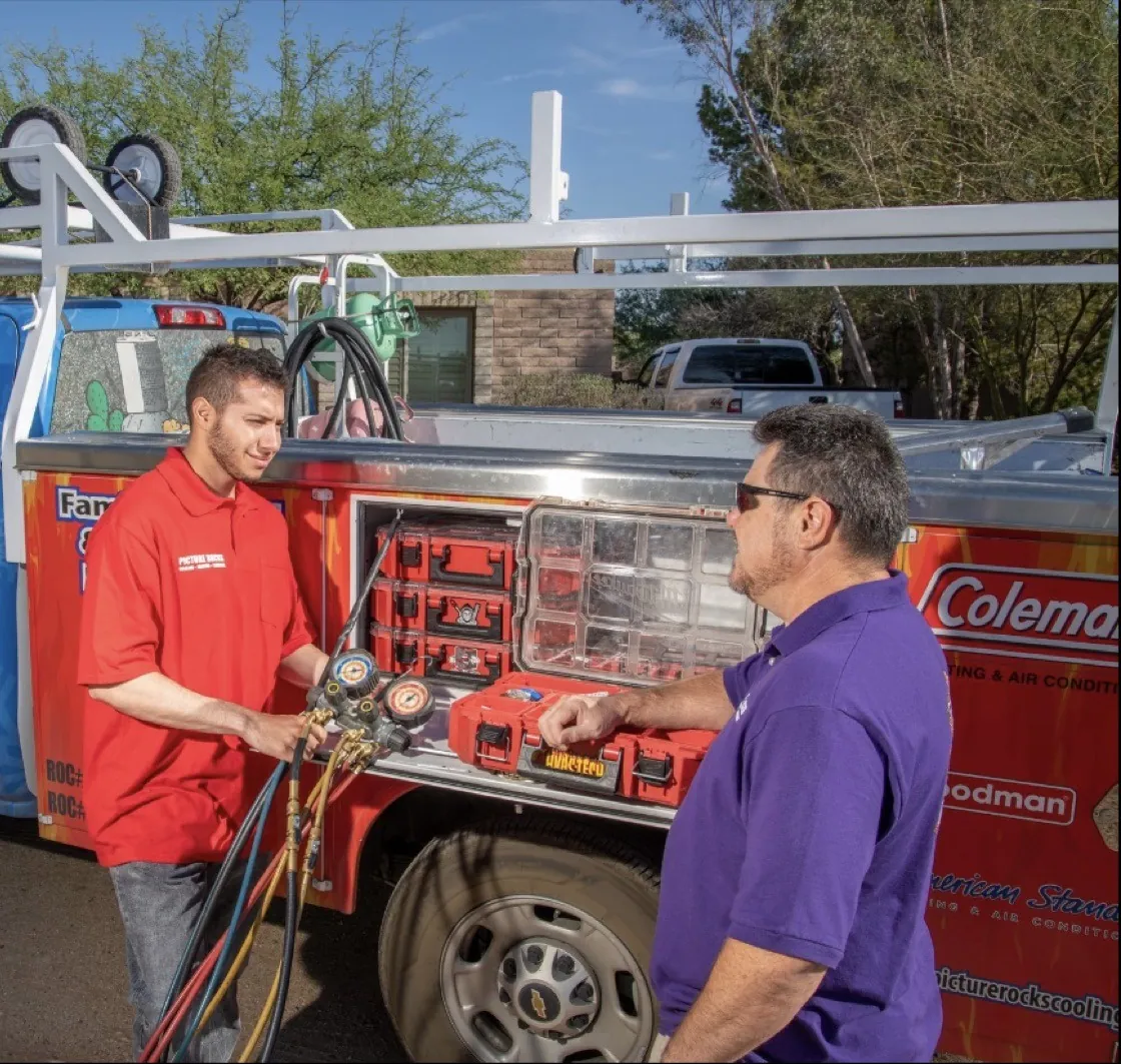 A Picture Rocks technician running digital gauges while walking a homeowner through the readings