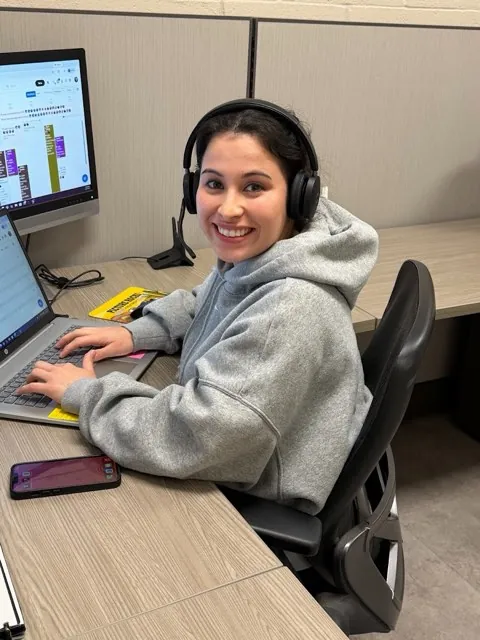 A Picture Rocks customer service rep taking a call at her desk in the Tucson office