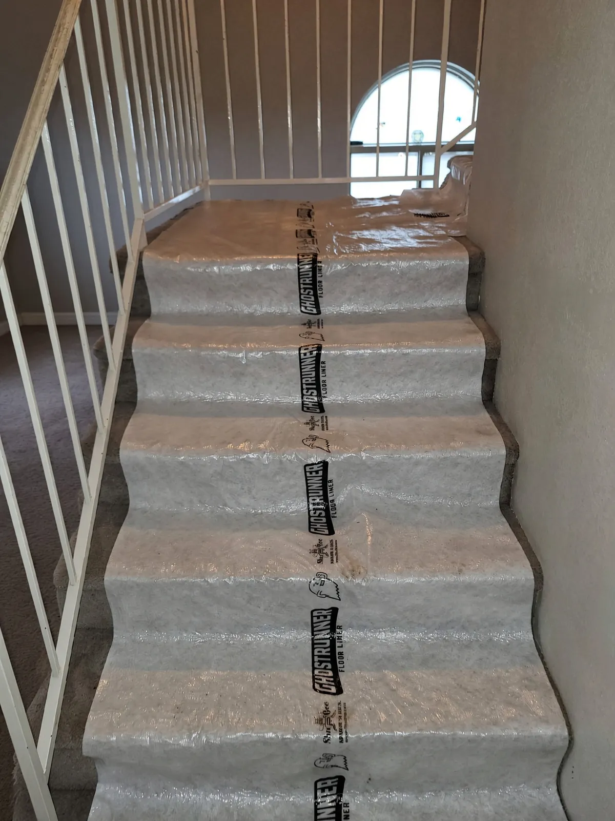 Floor-protection runners laid down through the home before an installation begins