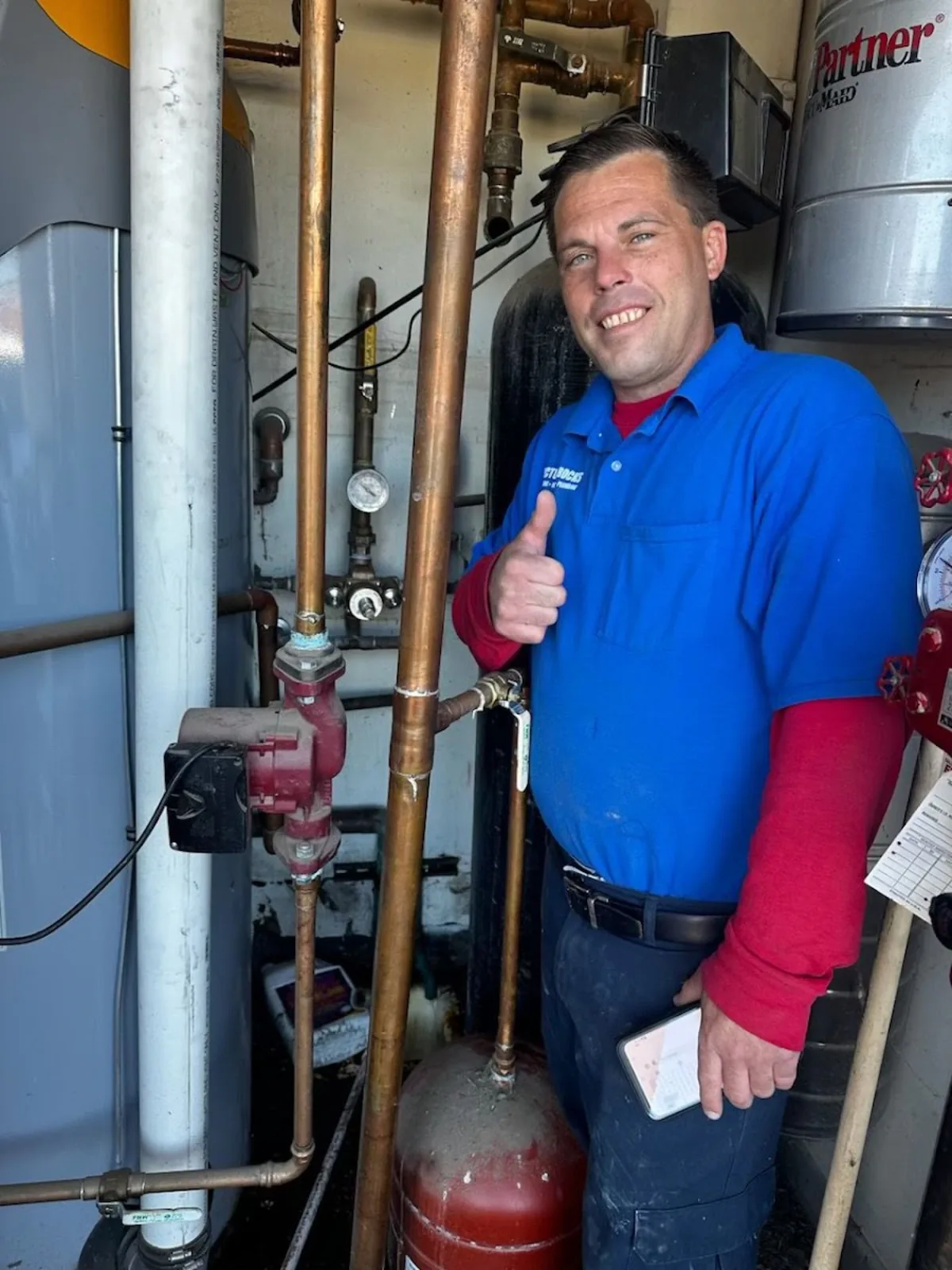 Picture Rocks plumber giving a thumbs-up after servicing a water heater.