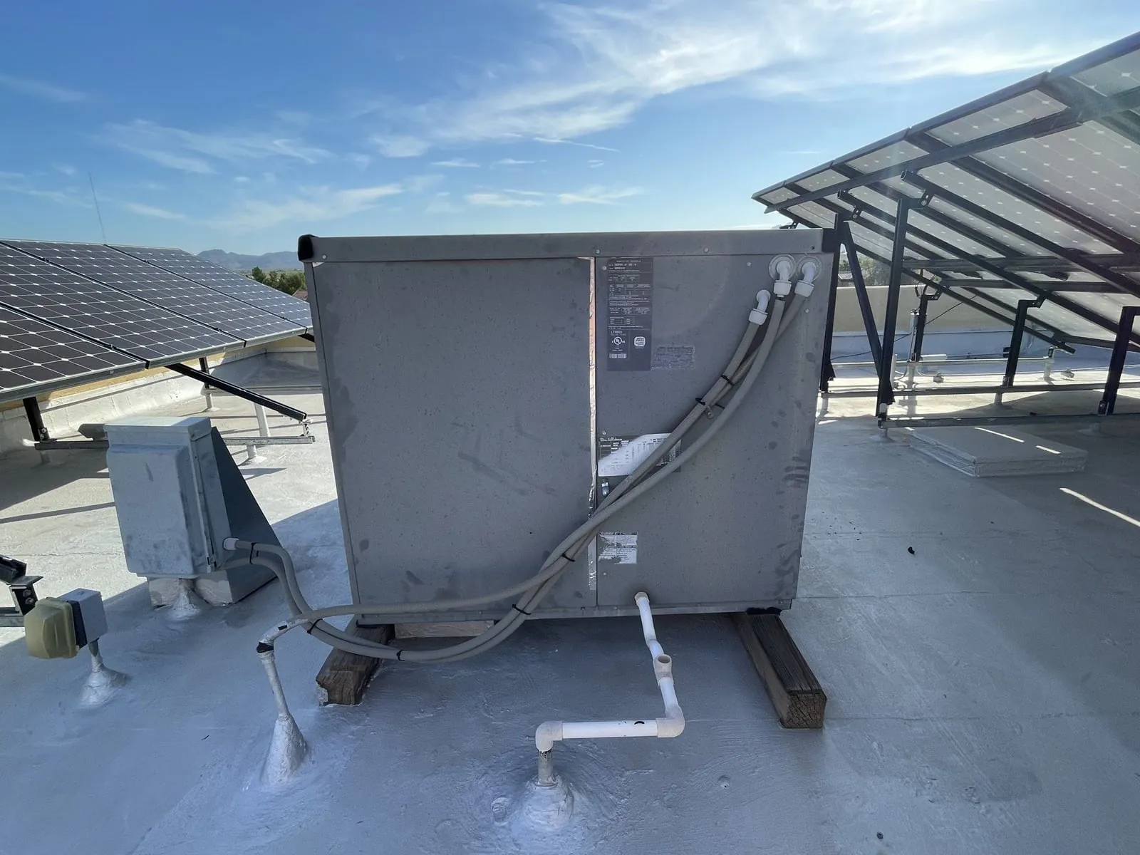 The old rooftop package unit before removal.
